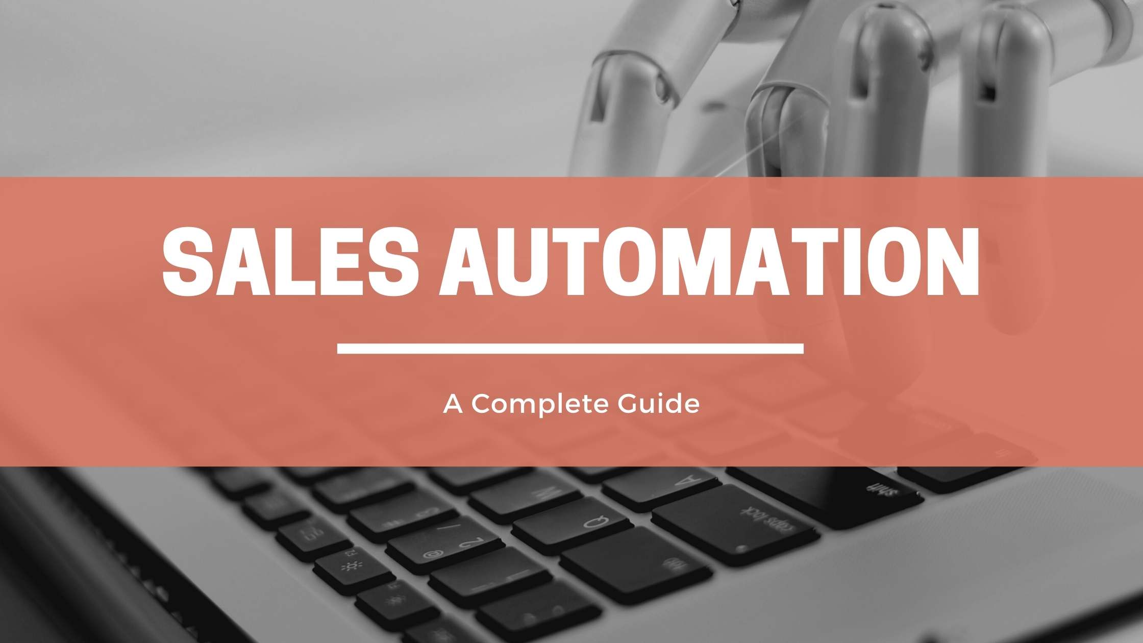 Robot typing on computer with sales automation text.